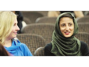 Kaitlin Robin, left, and Sana Khan attend Beyond the Veil at the University of Saskatchewan on Thursday.