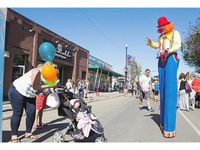 1. Kenni the Clown entertains at the Broadway Street Fair