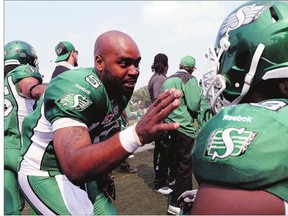 Kevin Glenn, left, shown talking on Sunday with offensive tackle Xavier Fulton during a CFL game against the Toronto Argonauts, has quickly made a positive impression with the Saskatchewan Roughriders.