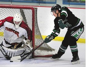 File Photo. Kyle Martin of the Saskatoon Westleys tries to jam the puck in the net against Tri-Town Thunder goalie Braydon Rubisch in Prairie Junior League hockey action at Harold Latrace Arena on Oct. 26, 2015.