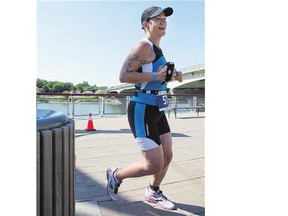 Laura Fouhse runs in the Subaru triathlon at River Landing on Sunday. She was one of 75 women in the race.