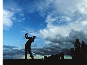 Leader Dustin Johnson tees off on the eighth hole during the rain-shortened second round of the 144th Open Championship at The Old Course Friday in St Andrews, Scotland.