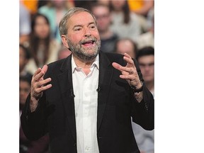 NDP Leader Tom Mulcair addresses supporters during a campaign stop in Toronto Sunday. Party leaders will debate foreign policy Monday.