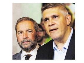 NDP Leader Tom Mulcair, left, announced former Saskatchewan finance minister Andrew Thomson will run in a Toronto riding.