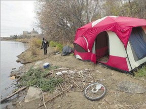 At least five people are reportedly living in this tent on the riverbank near the University Bridge.