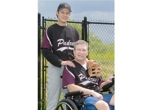 Reg Lalach, right, and his son Matt Lalach pose for a photo in their backyard in Martensville Sunday. Reg Lalach, who suffered a stroke earlier this year, and his son both have connections to the Saskatoon Padres softball team.