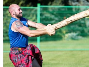New competitors are trained in the caber toss during the Highland Games at Diefenbaker Park on Saturday.