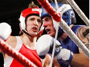 Liberal MP Justin Trudeau, left, fights Conservative Senator Patrick Brazeau during charity boxing match for cancer research Saturday, March 31, 2012 in Ottawa .