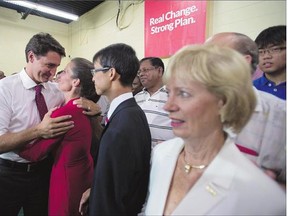 Liberal Leader Justin Trudeau greets candidates after making an announcement in Toronto on Wednesday. Trudeau said a Liberal government would allow Canadians to repeatedly dip into their RRSPs to pay for a home. Current rules only permit a single withdrawal for first-time home buyers.