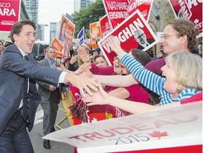 Liberal Leader Justin Trudeau greets supporters as he arrives for the Munk Debate on foreign affairs, in Toronto on Monday.