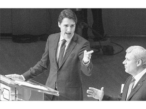 Liberal Leader Justin Trudeau, left, and Conservative Leader Stephen Harper trade words during the Munk Debate on foreign affairs in Toronto on Monday.