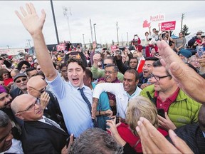 Liberal Leader Justin Trudeau makes his way through a crowd of supporters outside a rally on Sunday in Calgary.