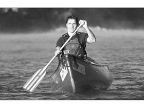 Liberal Leader Justin Trudeau paddles down the Bow River in Calgary on Thursday morning.