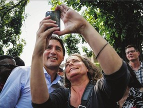 Liberal Leader Justin Trudeau poses for a photo as he greets supporters during a campaign stop in Calgary, Alta., on Monday. Trudeau has an uphill battle in Calgary, where the Liberals haven't had an MP elected since 1968.