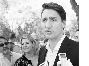 Liberal Leader Justin Trudeau says the 'conspicuous absence' of Conservative leader Stephen Harper at the annual gay pride parade in Montreal, Sunday, shows he is not 'choosing to be the prime minister for all Canadians.'