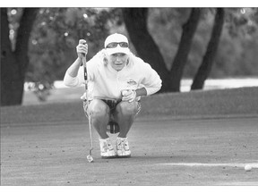Lori Boyle lines up her shot during round one of The Women's Open Golf Championships at Holiday Park. See Sports Report on Page B5 for standings.