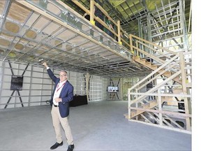 Marc Bovet, president and CEO of BONE Structure, stands inside a BONE structured home at 602 Temperance St. on Friday. The home, which still needs drywall and fixtures, was built in a Meccano or Lego style in just three weeks.