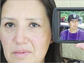 Marie-Eve Smith with an image of her murdered son Levi Marance on Wednesday in Saskatoon.
