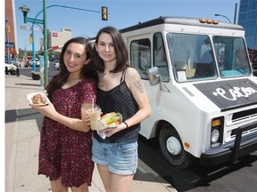 Marissa Venne, left, and sister Erin Sader, owners of Cocoa Food Inc. Food Truck, in front of their food truck in downtown Saskatoon, Tuesday, July 21, 2015.