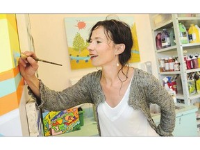 Marlessa Wesolowski, artist-in-residence at St. Paul's Hospital, paints a mural in her studio. As part of her unique position, Wesolowski guides patients through embracing their creative spirit, often when they are facing serious health challenges.