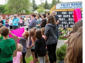 MARTENSVILLE,SK--JUNE 18 2015-Organizer Amy Dopko speaks during a rally to protest what they say is unfairly low provincial funding to the Prairie Spirit school division in Martensville on Thursday June 18th, 2015.(LIAM RICHARDS/STAR PHOENIX)
