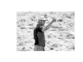 Martin Kaymer of Germany gives a thumbs up after a shot during a practice round in advance of the 115th U.S. Open Championship at Chambers Bay in University Place, Wash.