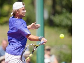 Matt Reid returns the ball against Aleksander Vukic (not pictured) during the Final of the Houghton Boston Tennis Classic at the Riverside Badminton and Tennis Club in Saskatoon on Sunday.