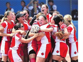 Members of Canada's women's softball team celebrate their 4-2 victory over the United States in Sunday's gold medal game at the Pan American Games in Ajax, Ont. The Canadian contingent finished second overall in the medal standings at the Games.