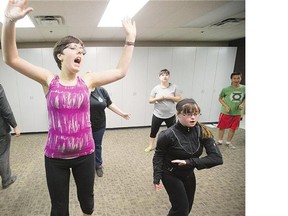 Members of the Tunetown Glee Club, including Crystal, front left, rehearse Wednesday for their end-of-summer show.