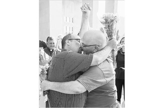 Michael Long, left, and Timothy Long kiss outside the Rowan County Judicial Center in Morehead, Ky., after becoming the second couple to receive a marriage licence from the centre on Friday.