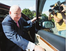 Sen. Mike Duffy leaves the courthouse in Ottawa on Monday, following testimony by Nigel Wright, former chief of staff to Prime Minister Stephen Harper. His lawyer said Wright sold the public 'a deliberately deceptive scenario.'