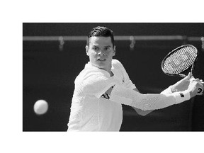 Milos Raonic returns a shot to Daniel Gimeno-Traver of Spain during a first-round match at Wimbledon on Monday.