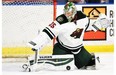 Minnesota Wild goaltender Darcy Kuemper stops a shot from the Edmonton Oilers during the first period of an NHL pre-season hockey game in Saskatoon, Sask., on Saturday, September 26, 2015.