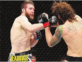 Mitch Clarke, left, is heartbroken after a freak accident rendered him unable to compete in Ultimate Fighting Championship's debut in his hometown of Saskatoon. 'It's devastating,' says Clarke.