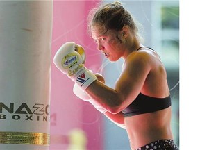 Mixed martial arts fighter Ronda Rousey works out at Glendale Fighting Club in Glendale, California, on July 15. The UFC's dominant bantamweight champion will defend her title against Bethe Correia on Saturday.