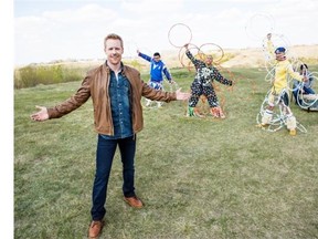 Jon Montgomery poses with Saskatchewan hoop dancers, including Terrance Littletent (centre), during filming at Wanuskewin Heritage Park for an episode of Amazing Race Canada.
