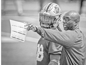 Montreal Alouettes defensive back Dominique Ellis listens to special teams co-ordinator Kavis Reed during a drill at practice at Stade Hebert in Montreal.