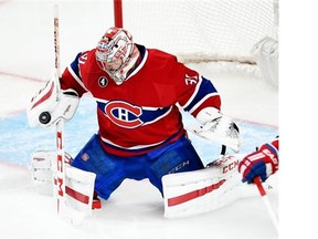 Montreal Canadiens goalie Carey Price (31) makes a save during first period of Game 1 NHL second round playoff hockey action against the Tampa Bay Lightning Friday, May 1, 2015 in Montreal.THE CANADIAN PRESS/Ryan Remiorz