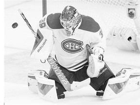 Montreal Canadiens goalie Mike Condon makes a save during the second period of a 3-1 win over the Ottawa Senators on Sunday, winning his first NHL start after earning the backup job in training camp.