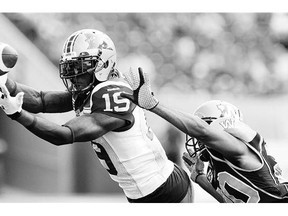 Montreal's S.J. Green can't hang onto the pass from quarterback Rakeem Cato during the first half of CFL action against the Winnipeg Blue Bombers in Winnipeg Friday.