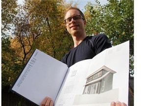 Dustin Main, organizer of the tiny-house meetup group in Saskatoon, shows off his plans for a tiny house at its future site in a Pacific Heights backyard.