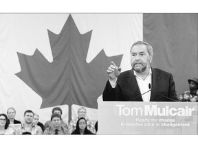 Tom Mulcair was on the defensive Sunday as Liberals and Conservatives took aim at the cost of the NDP's campaign platform.