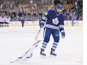 Nazem Kadri picks up a Maple Leafs jersey on the ice after Toronto was defeated by the Washington Capitals in January 2015.