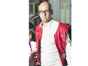 Neil Bantleman is led out of a courtroom last April. An Indonesian court has overturned the sex abuse conviction against Bantleman.