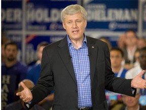 Prime Minister Stephen Harper addresses supporters during a rally at the Best Western Lamplighter Inn in London, Ont. on Wednesday August 19, 2015.