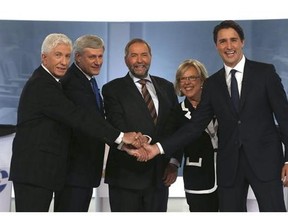 Canadians finally get to vote today after an 11 week campaign. Bloc Quebecois Leader Gilles Duceppe, left to right, Conservative Leader and Prime Minister Stephen Harper, New Democratic Party Leader Thomas Mulcair, Green Party Leader Elizabeth May and Liberal Leader Justin Trudeau are shown shaking hands before the start of the French-language leaders' debate in Montreal on Thursday, September 24, 2015. THE CANADIAN PRESS/POOL-Christinne Muschi
