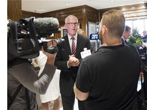 Clive Caldwell, president and CEO of Cambridge Group of Clubs, speaks with members of the media at the Cambridge Club in Toronto on Aug. 26, 2015.