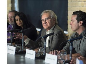 Stephen Lewis, centre, speaks next to Ashley Callingbull, left, Mrs. Universe 2015, and author Joseph Boyden while joining other actors, activists, and musicians in launching the Leap Manifesto outlining a climate and economic vision for Canada during a press conference in Toronto on Tuesday, September 15, 2015.