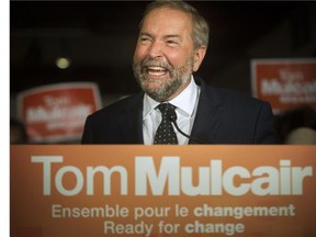 NDP Leader Tom Mulcair talks to supporters and the press as he takes his campaign to the new federal riding of Notre-Dame-de-Grace-Westmount, in Montreal, on Friday, August 28, 2015.