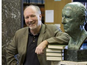Law professor Brent Cotter next to a bust of the Honourable Emmet Mathew Hall, who was Saskatchewan's last Supreme Court Justice appointment in 1962.